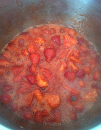 Strawberries cooking for jam